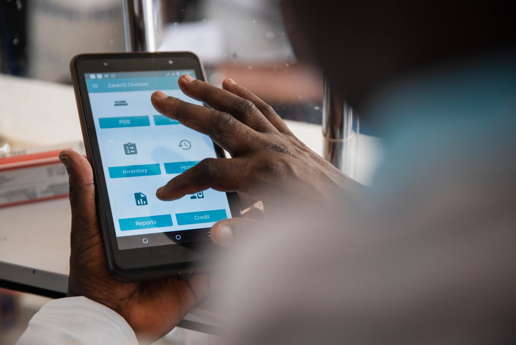 Pharmacist using the Maisha Meds app